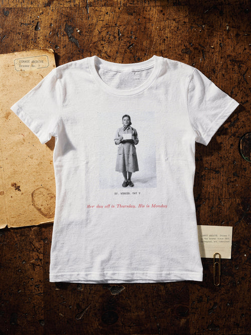 Print XV, the worker: a woman worker holding a card, with the red line Her day off is Thursday. His is Monday, on a white T-shirt